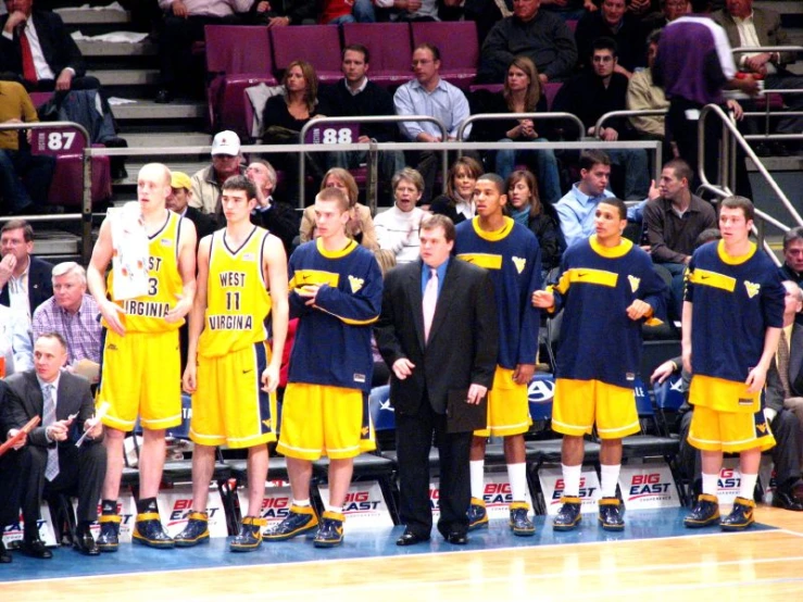 a coach talking to his team on the basketball court