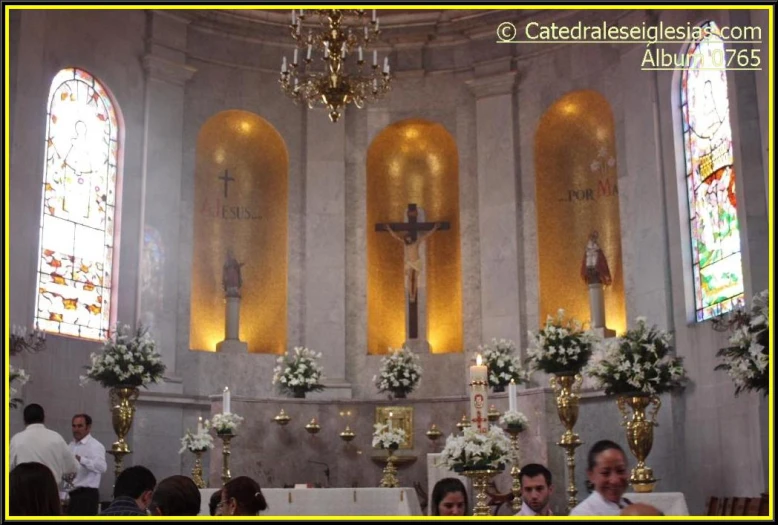 a large church with a cross hanging from the ceiling