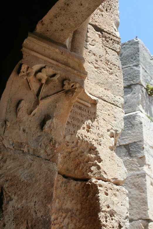 carvings and the wall is made of concrete