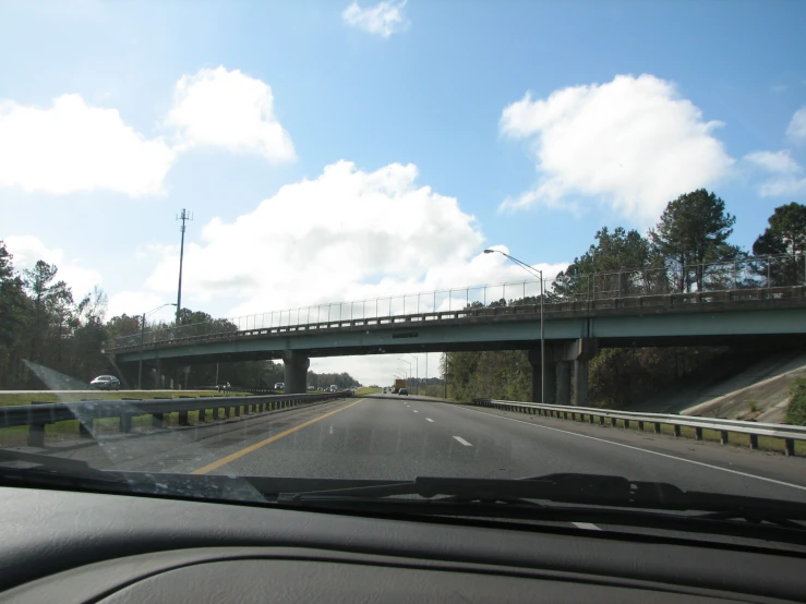 there is a long bridge going over the road