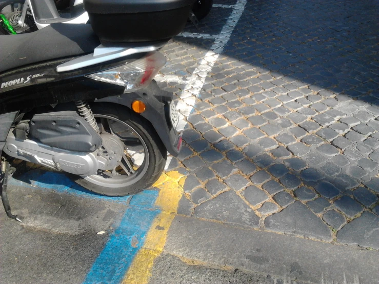 the front view of a motorcycle that is parked in a parking lot