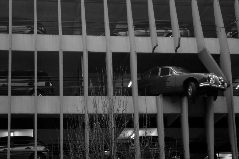 a car is shown on a bridge above other cars