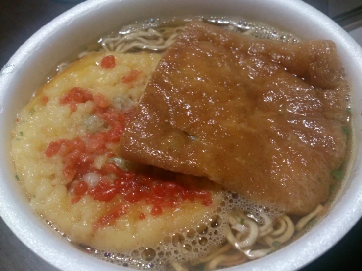 a white bowl filled with asian food