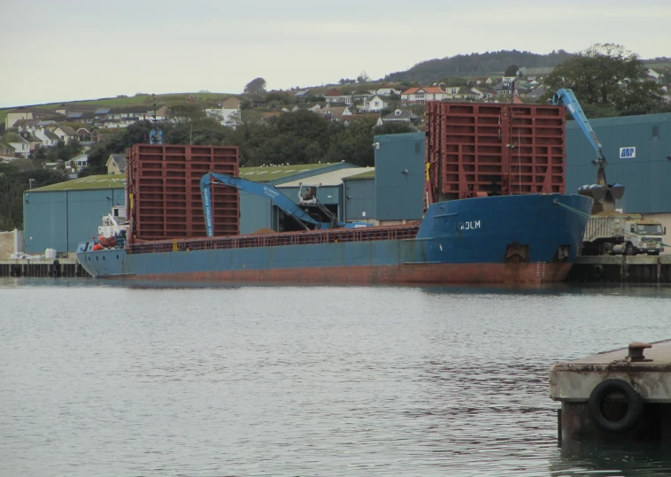 a large boat being loaded with containers