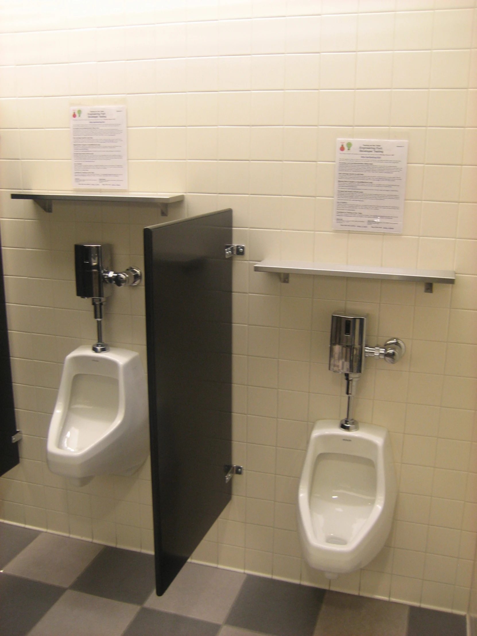 this is a po of urinals in a public restroom