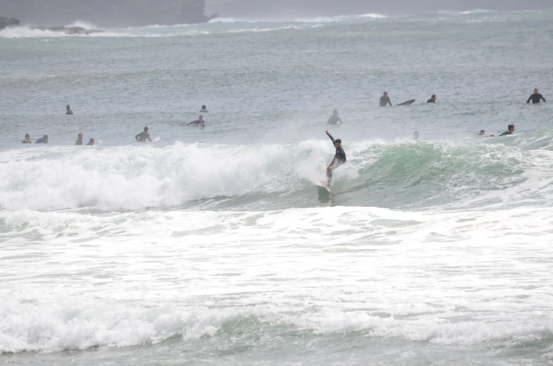 a surfer riding a surf board on the ocean waves