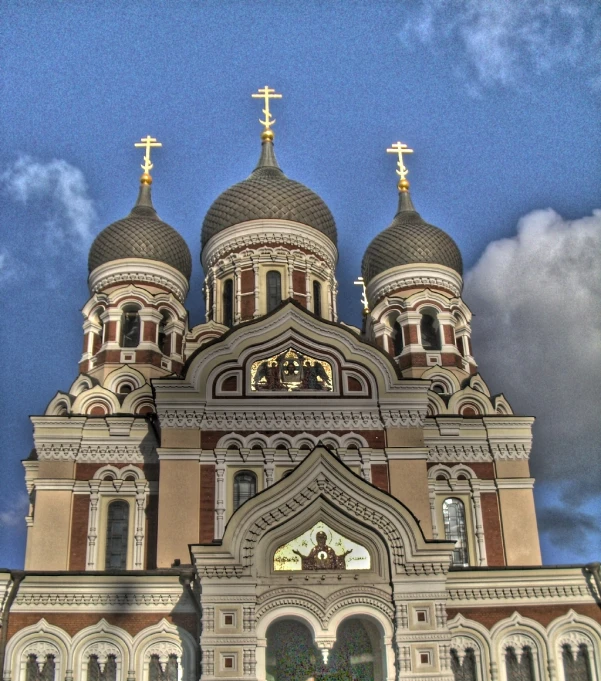 the front entrance to an ornately designed church