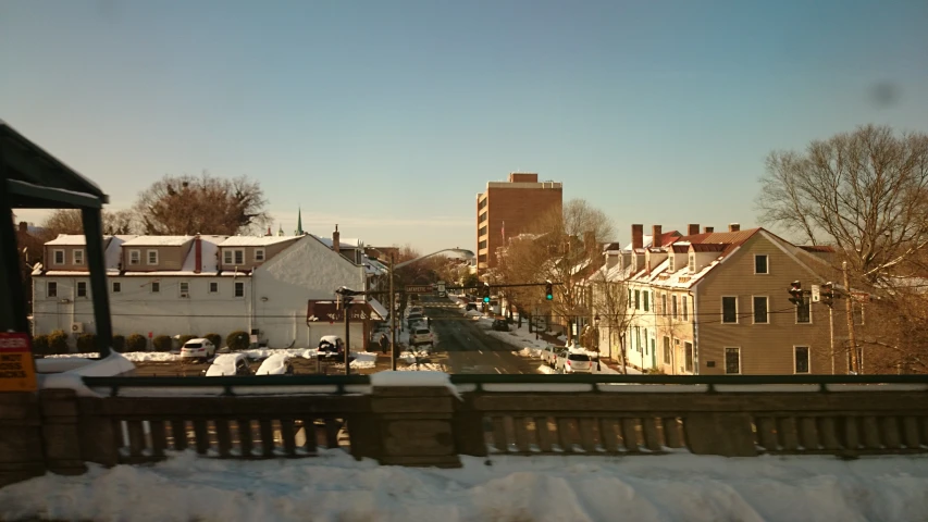 the view of a city from a balcony in winter