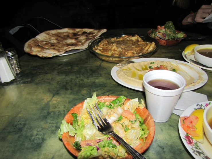 a close up of several plates of food on a table