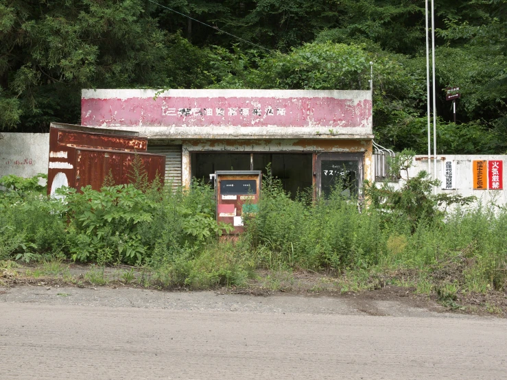 there is a red door and an empty building