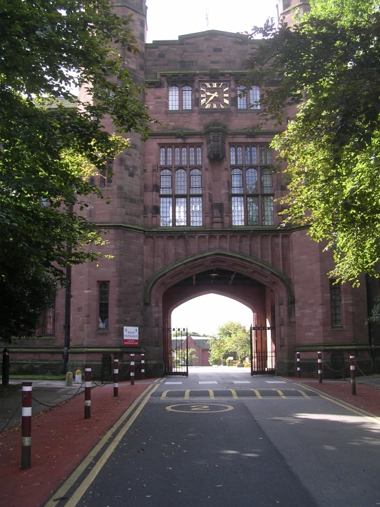 an entrance to an old brick building with arched doorways