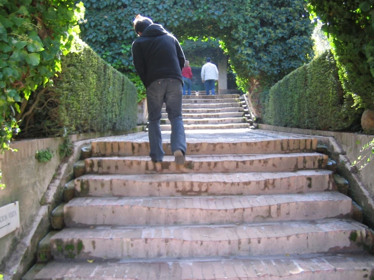 a person walking down some steps that lead up to another person