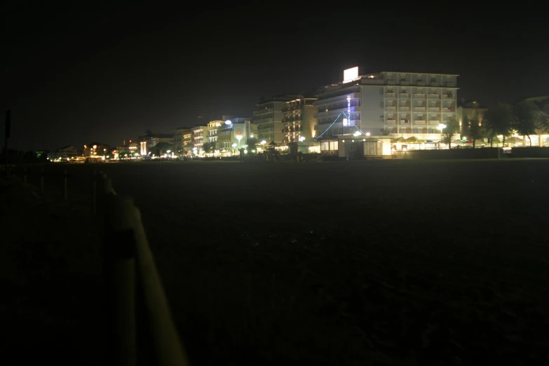 a night view of buildings in a park