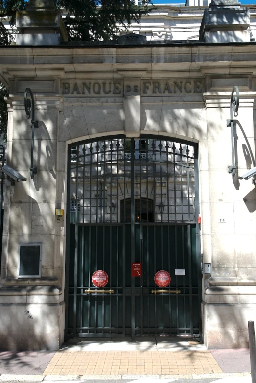 a gated entrance to a building with an entrance