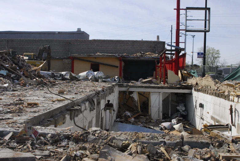 a pile of rubble and other rubble near a building