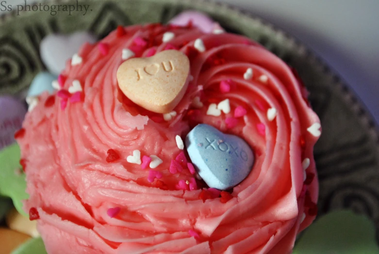 two hearts in a cupcake made to look like they were kissing