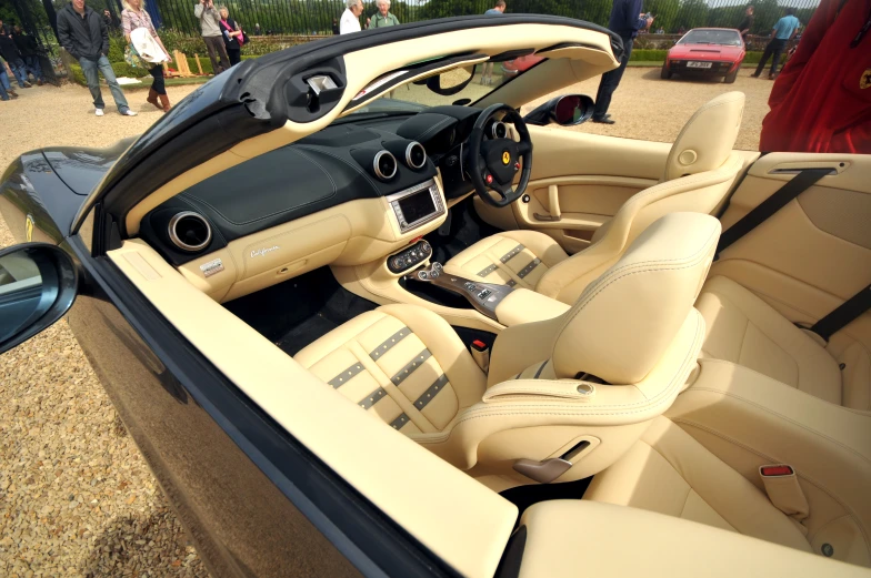 the inside of a vehicle with leather seats and dash board