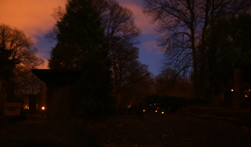 the view of the cemetery at night time from the street