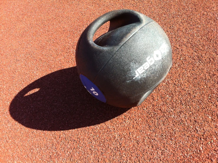 a ball is on the ground near a cement surface