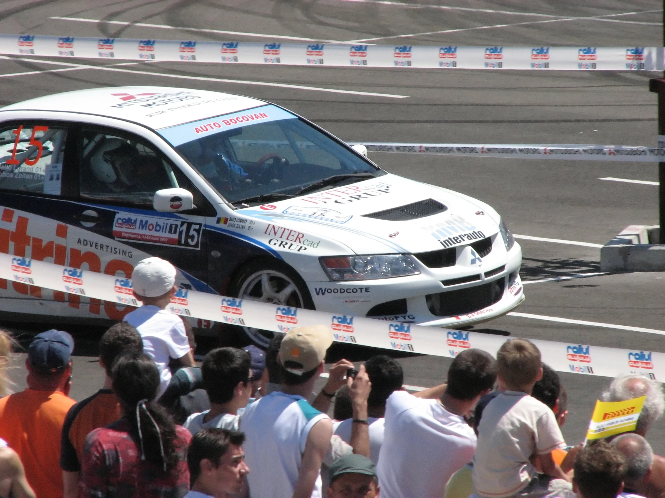 there is a rally car driving on the track