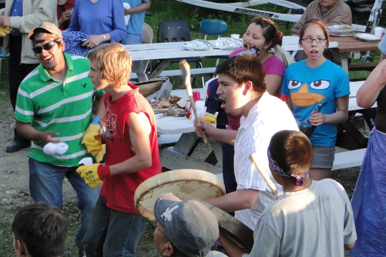 a group of people gathered outside at an outdoor event