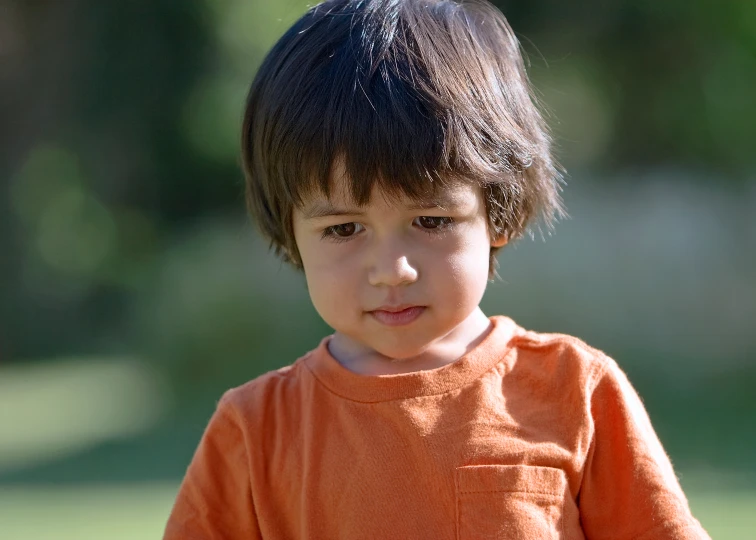 a little girl with a short black haircut