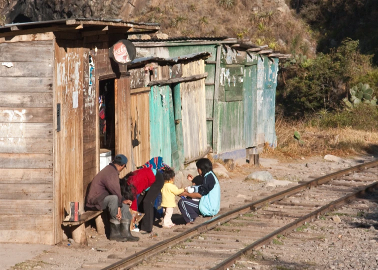 group of people hanging out at the train track