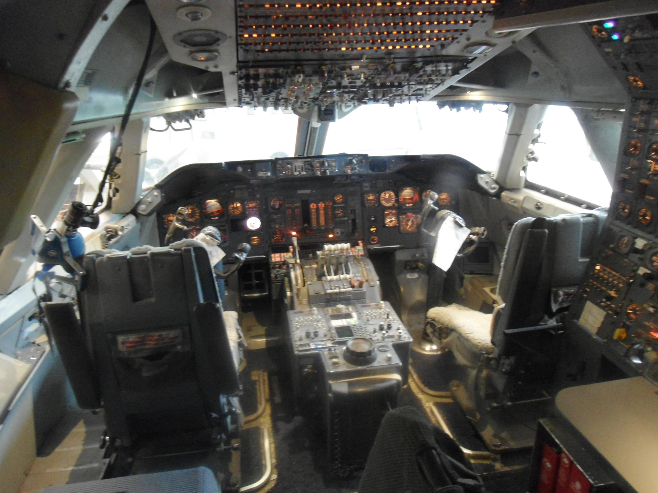 an airplane cockpit with two people sitting inside