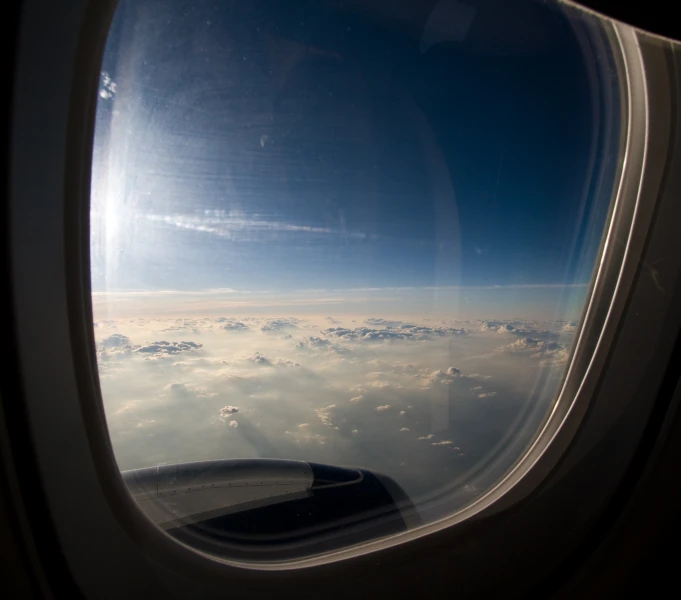 the view of the sky from the window of an airplane