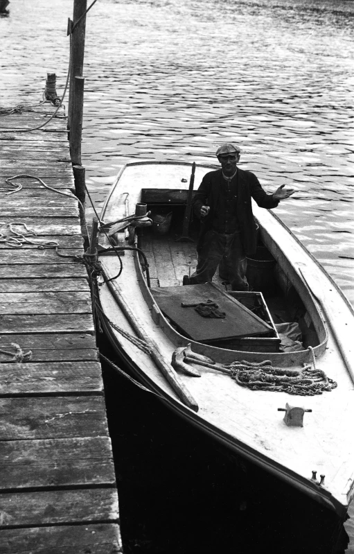 a man in a boat docked in the water