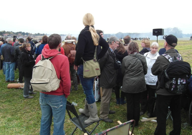 a group of people are standing next to each other