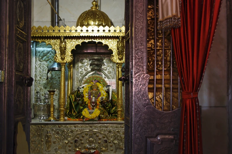 a statue of lord ganesh sits inside of a doorway