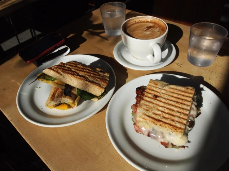 a close up of two plates of food on a table