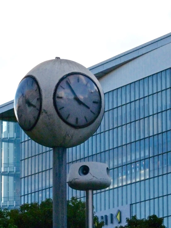 there are two clocks in the middle of a pole
