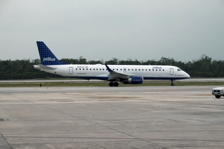 an airplan sits on a tarmac with another in the background