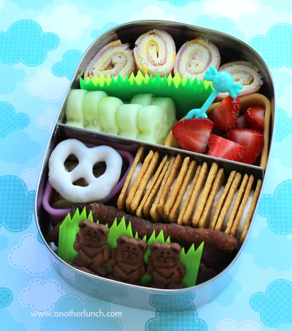 the small tin is filled with sweets and snacks