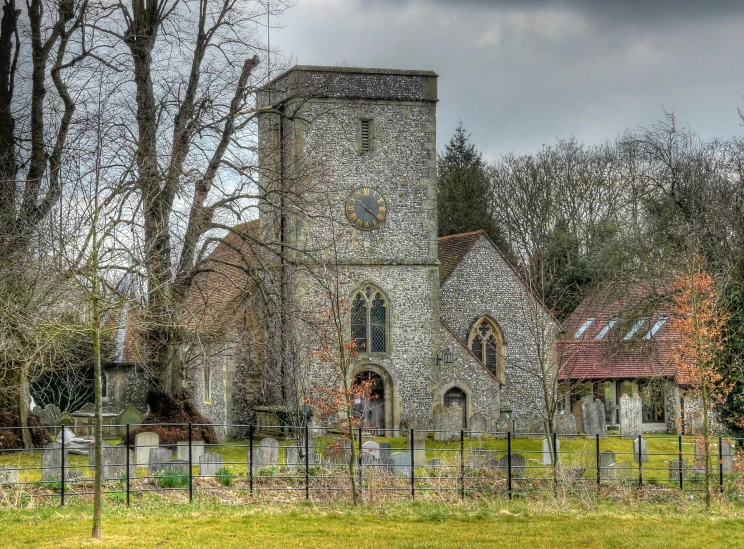 there is an old stone building near a tree