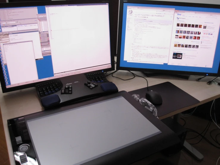 two monitors with various screens of data on them