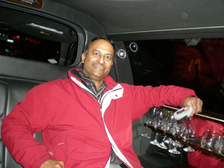 a man in a car putting his hand on a glass