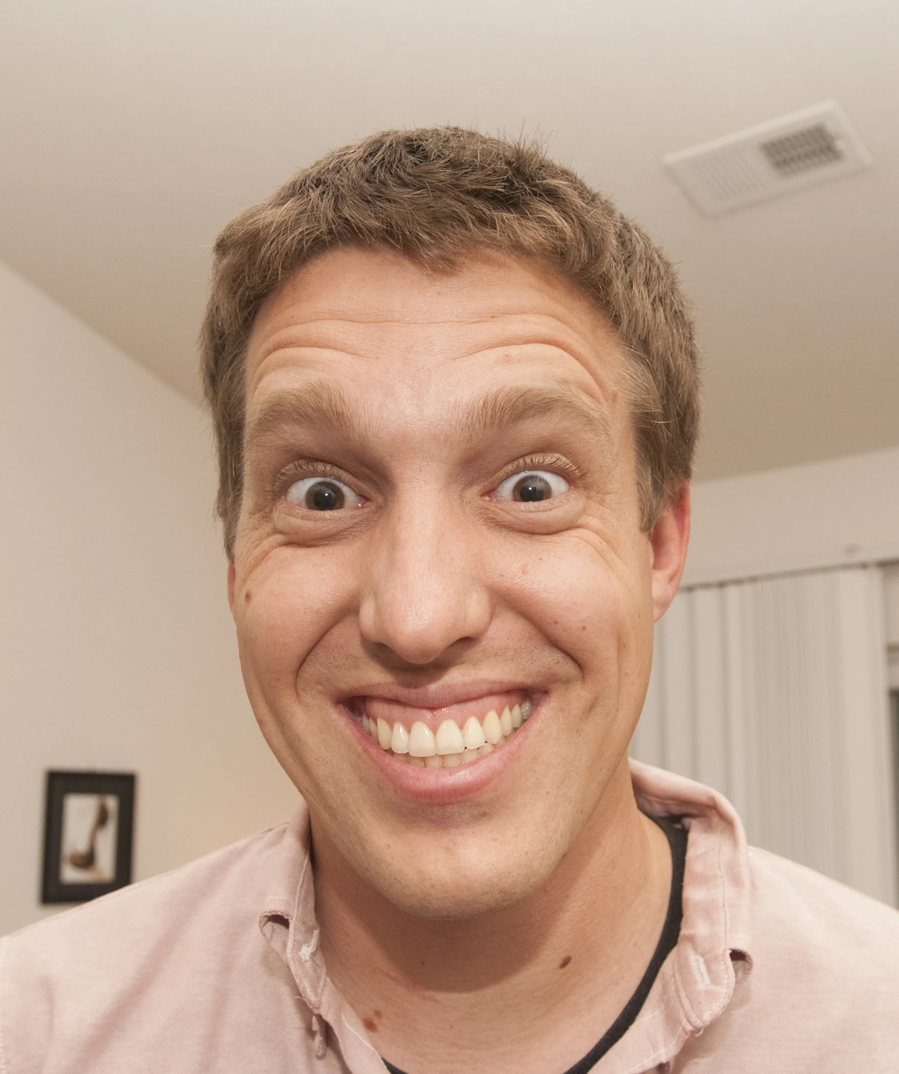 man smiling with a stethoscope in his mouth