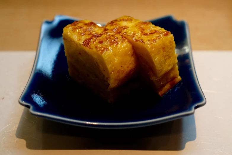 a close - up of two pieces of food on a plate