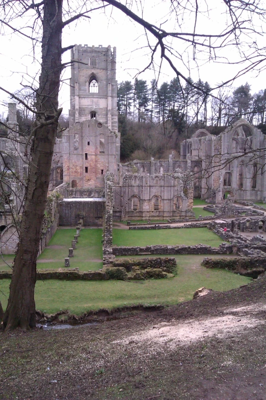 a very old cemetery with a large tower