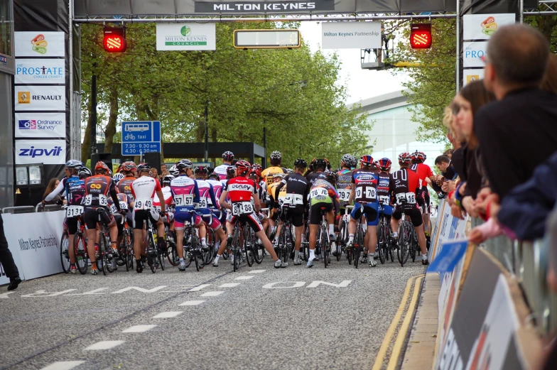 many cyclists lined up to start a bicycle race