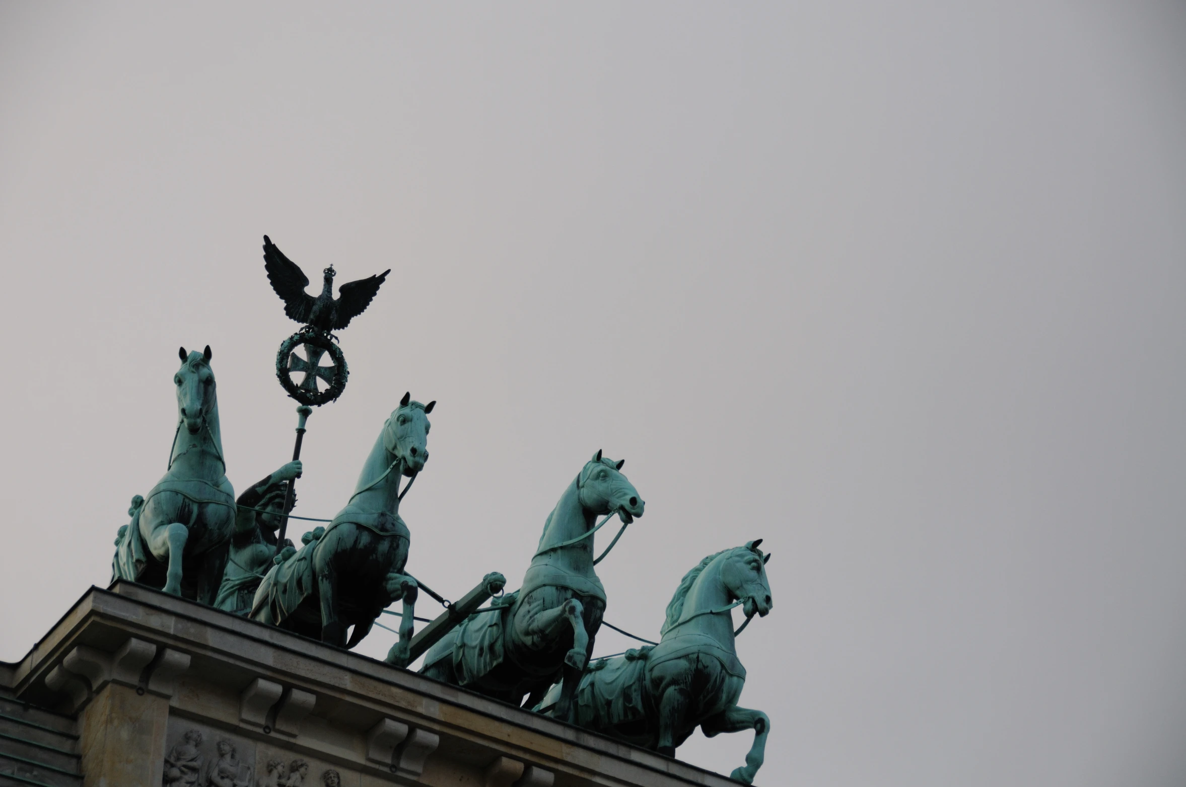 statues on top of the old city building