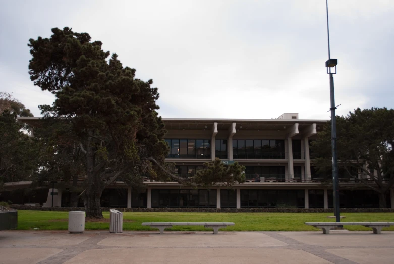 this building is made out of concrete and has a large window