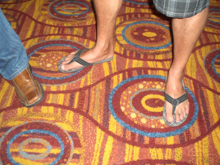 the two people are standing on the carpet