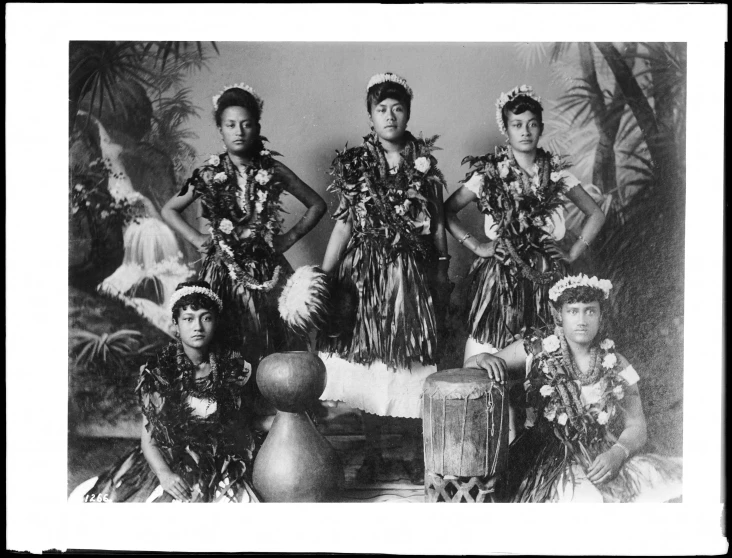 the three hula dancers are posing together