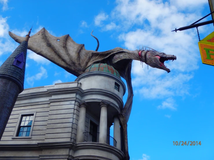 there is a giant dragon that is near a building