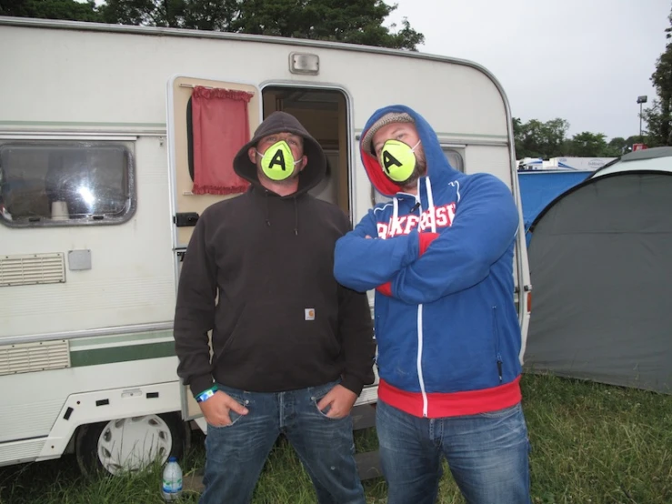 two men with their face painted like tennis balls