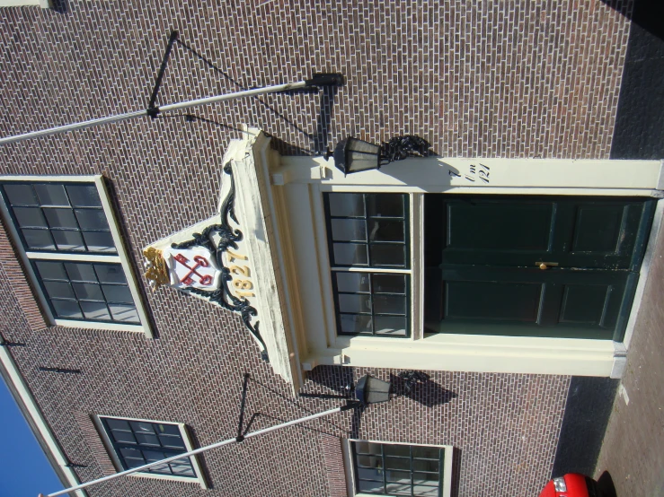 a very old brick building with a clock on the front